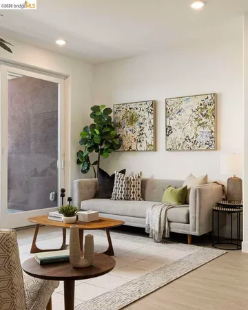 a living room with furniture and a rug