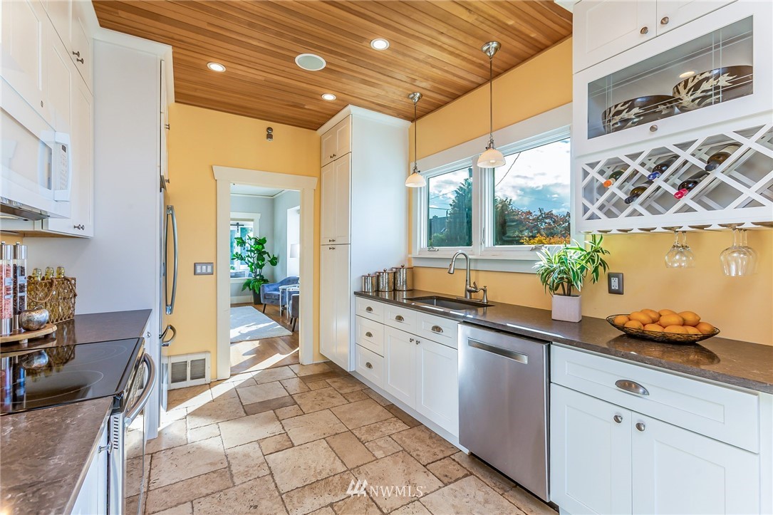 4140 Southwest Ida Street Seattle, WA 98136 - Photo 11 of 39 a large white kitchen with a large window