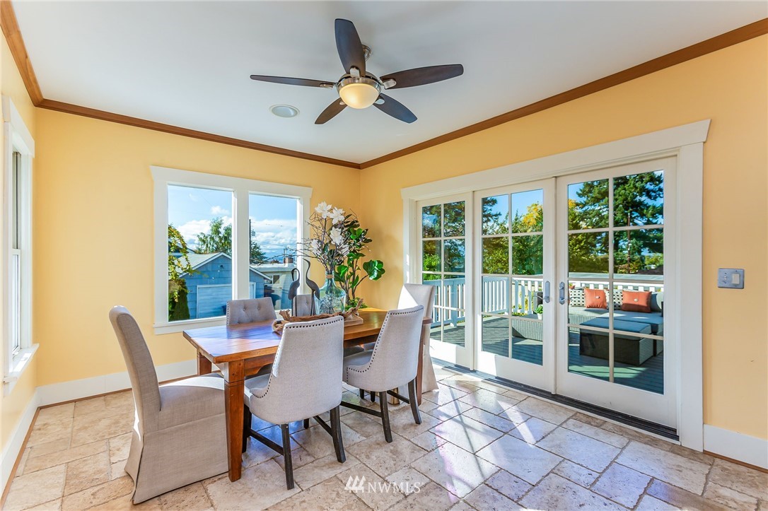 4140 Southwest Ida Street Seattle, WA 98136 - Photo 14 of 39 a dining room with furniture a rug and a large window