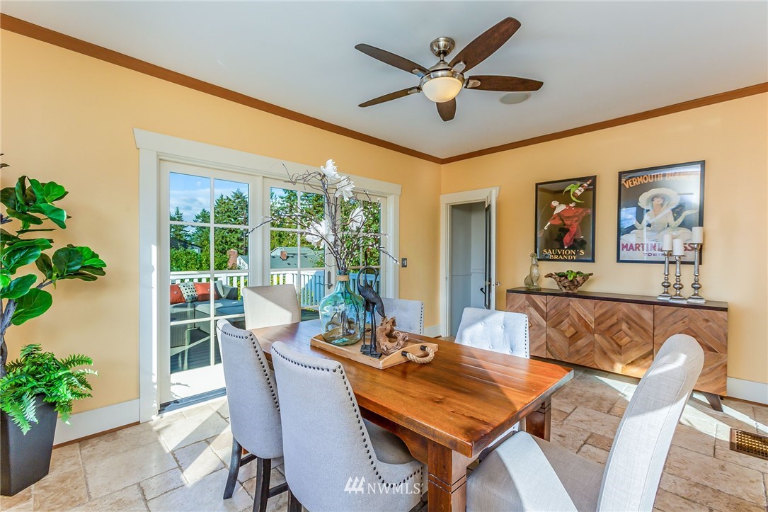 4140 Southwest Ida Street Seattle, WA 98136 - Photo 16 of 39 a dining room with furniture potted plants and wooden floor