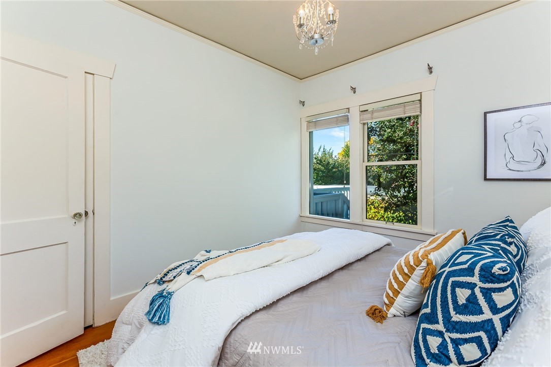 4140 Southwest Ida Street Seattle, WA 98136 - Photo 19 of 39 a bedroom with a bed and a window