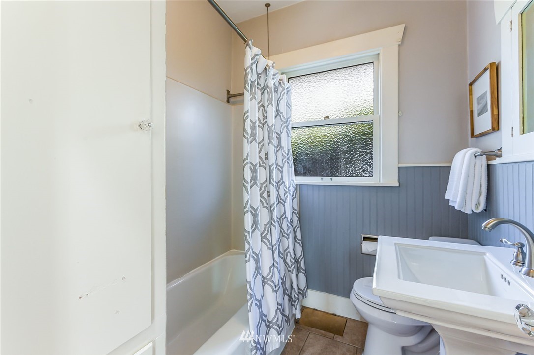 4140 Southwest Ida Street Seattle, WA 98136 - Photo 24 of 39 a bathroom with a shower a toilet and sink