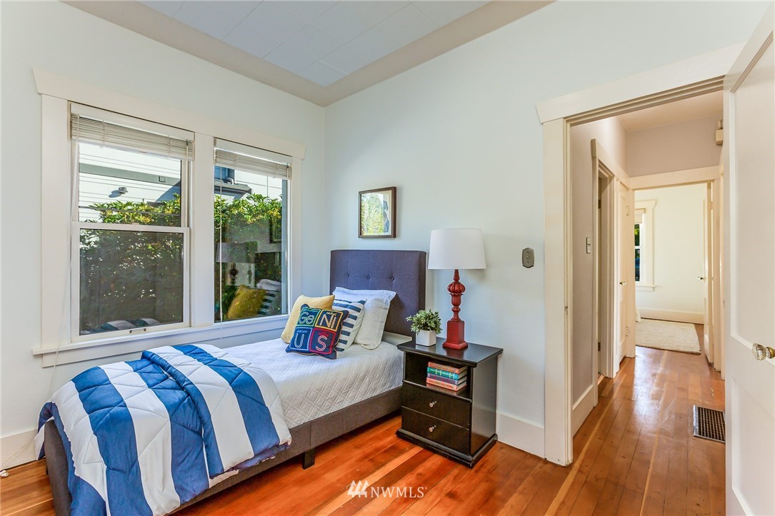 4140 Southwest Ida Street Seattle, WA 98136 - Photo 25 of 39 a bedroom with a bed and a large window