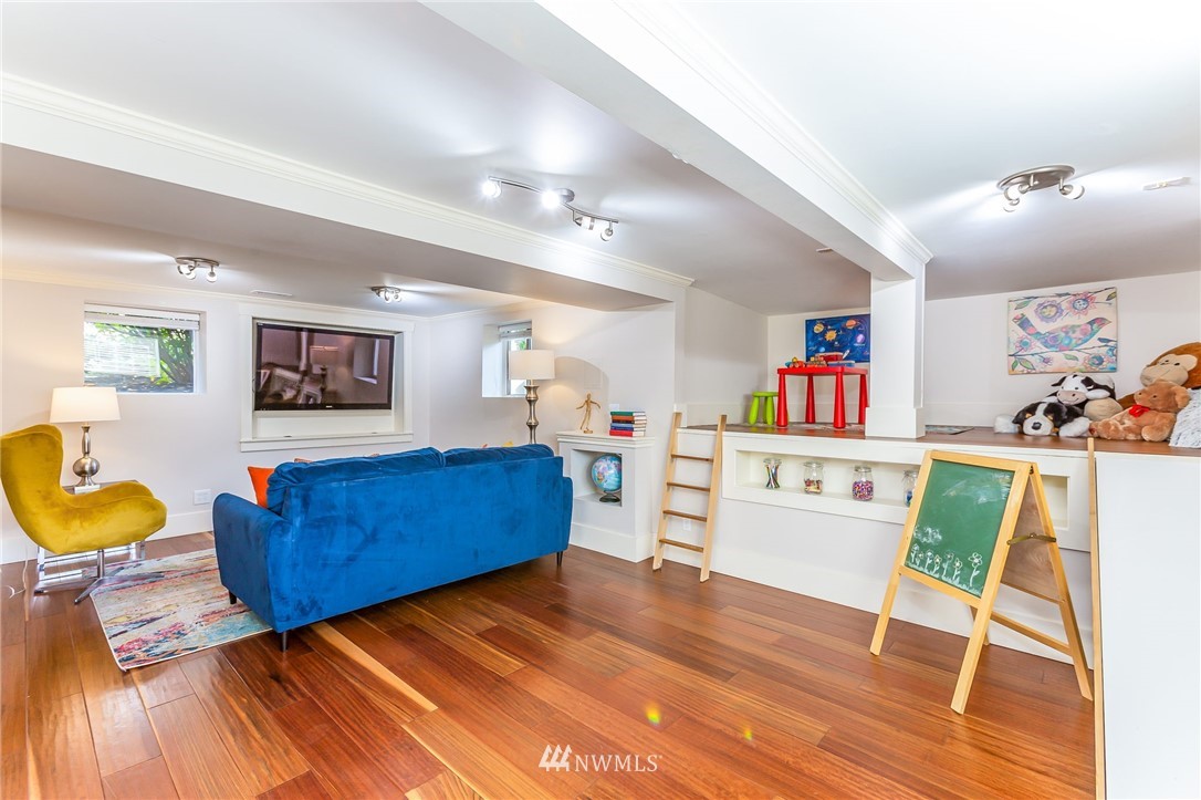 4140 Southwest Ida Street Seattle, WA 98136 - Photo 30 of 39 a living room with furniture and a wooden floor