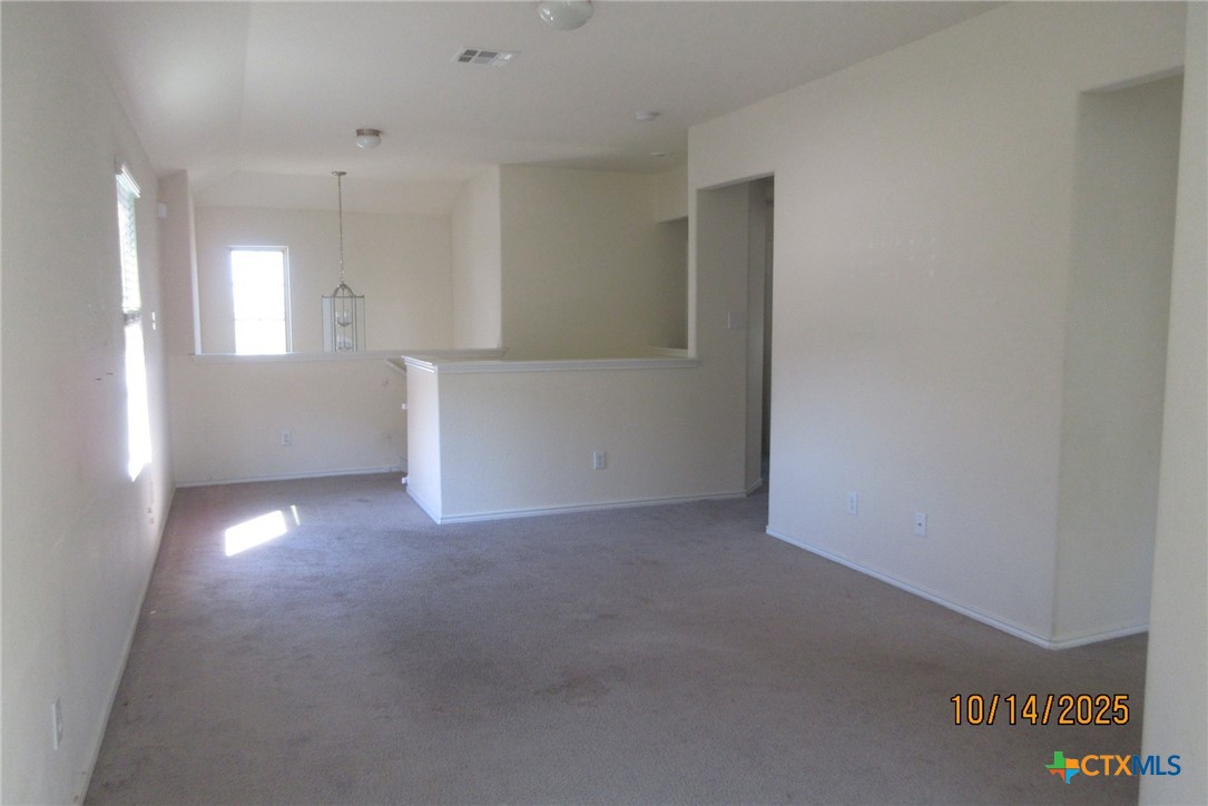 117 Open Sky Way, Unit 4D Jarrell, TX 76537 - Photo 19 of 36 a view of an empty room with a window