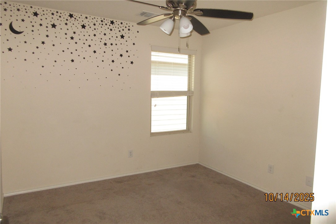 117 Open Sky Way, Unit 4D Jarrell, TX 76537 - Photo 30 of 36 an empty room with a window