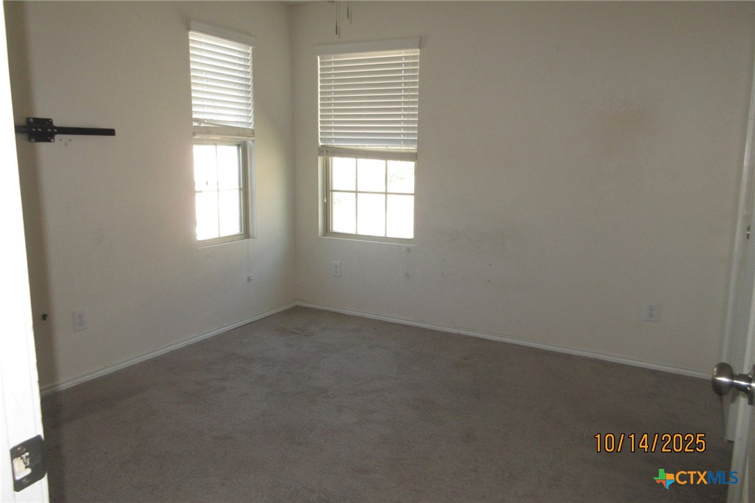 117 Open Sky Way, Unit 4D Jarrell, TX 76537 - Photo 32 of 36 an empty room with a window