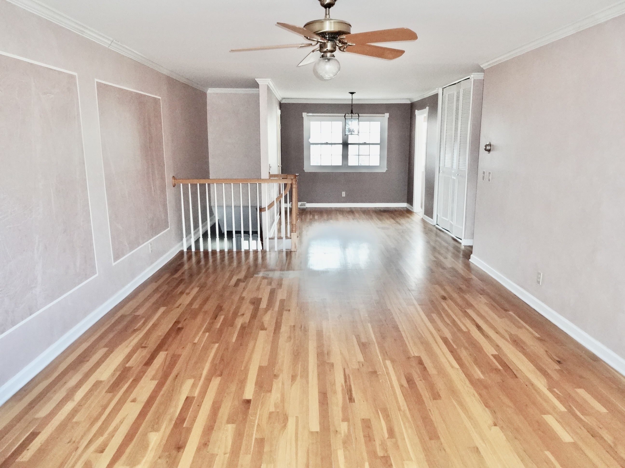 245 Unquowa Road, Unit 34 Fairfield, CT 06824 - Photo 12 of 24 a view of an empty room with wooden floor and a window