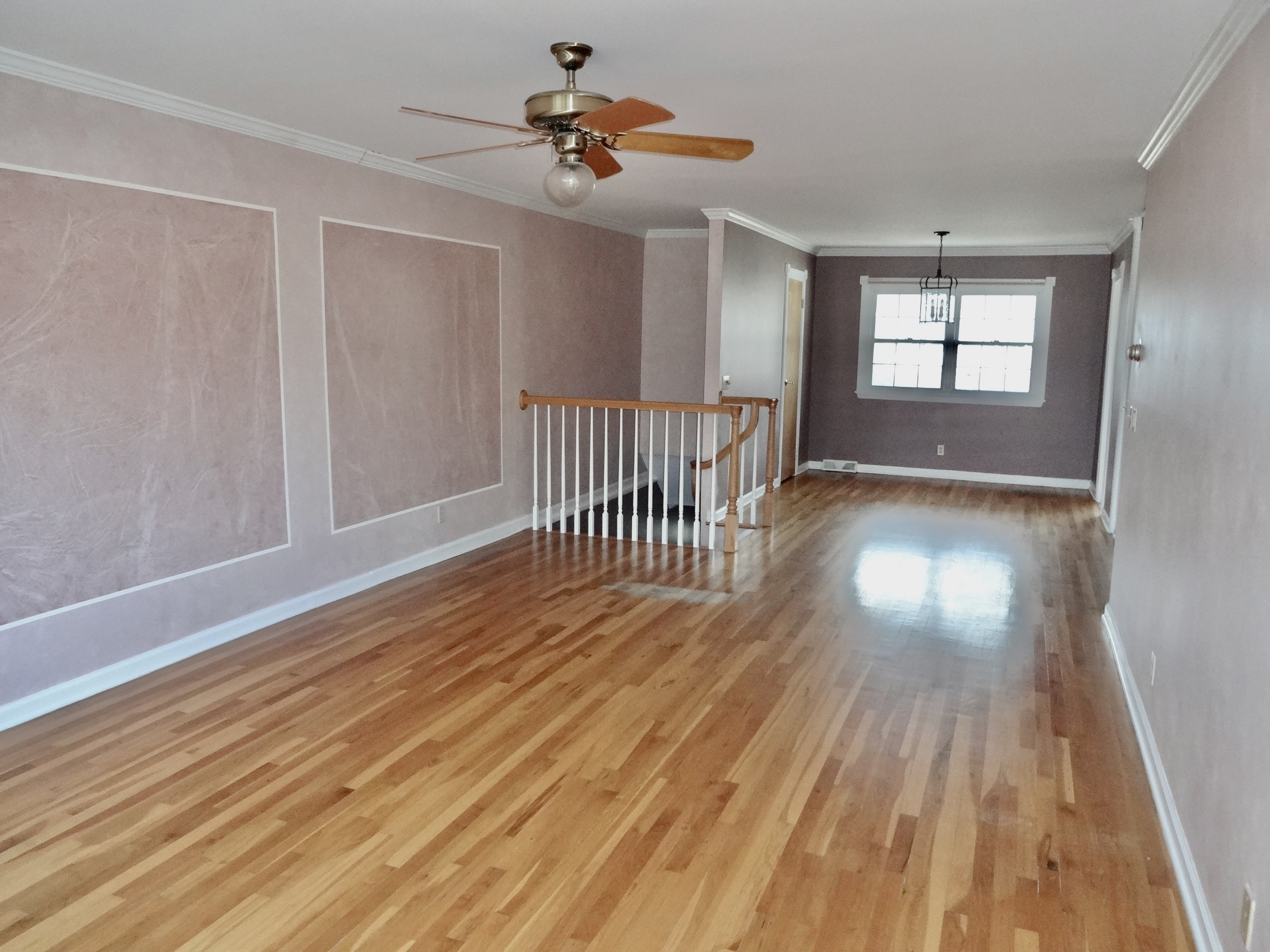 245 Unquowa Road, Unit 34 Fairfield, CT 06824 - Photo 14 of 24 a view of empty room with wooden floor and fan