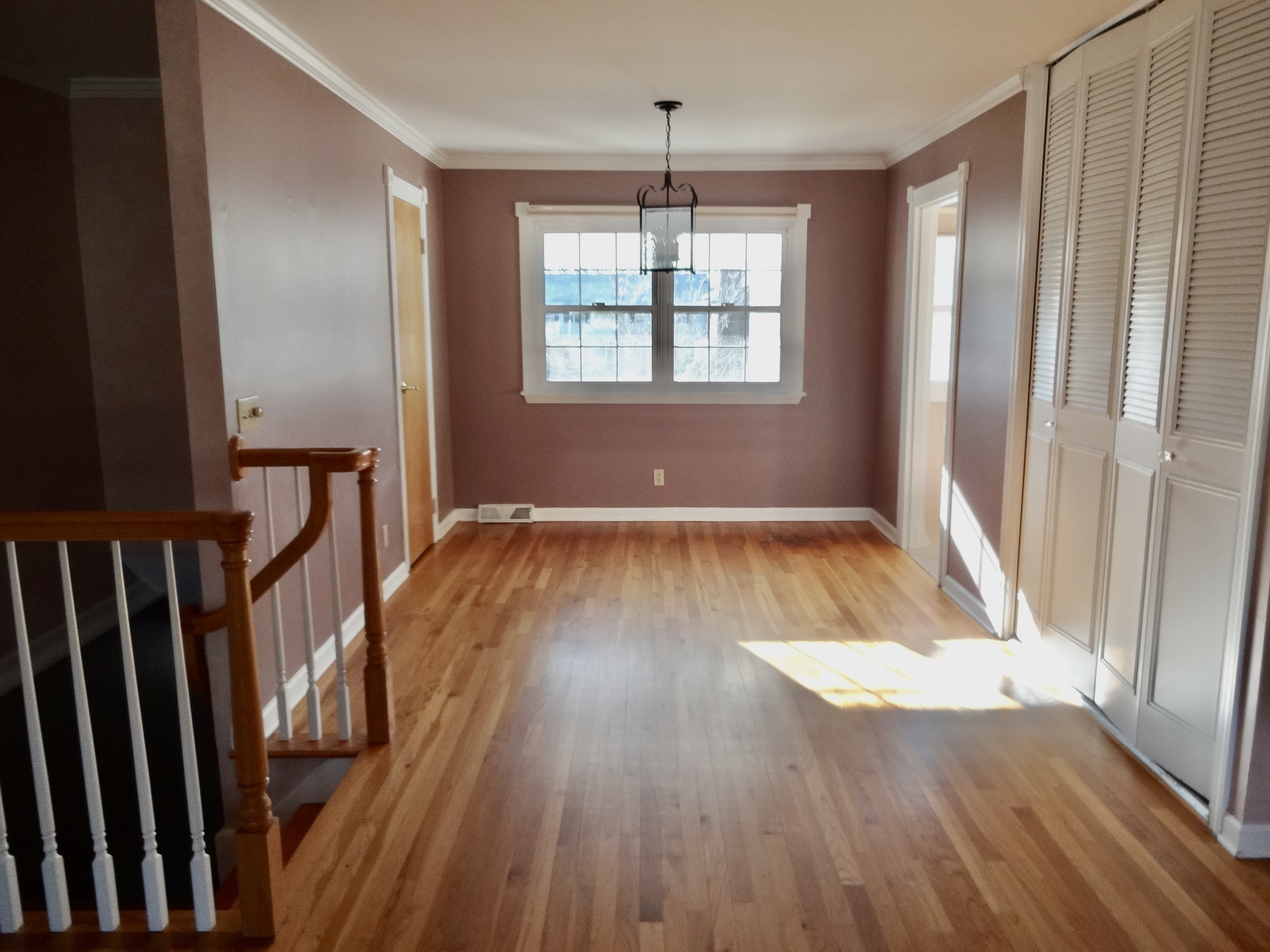 245 Unquowa Road, Unit 34 Fairfield, CT 06824 - Photo 16 of 24 a view of empty room with wooden floor and fan