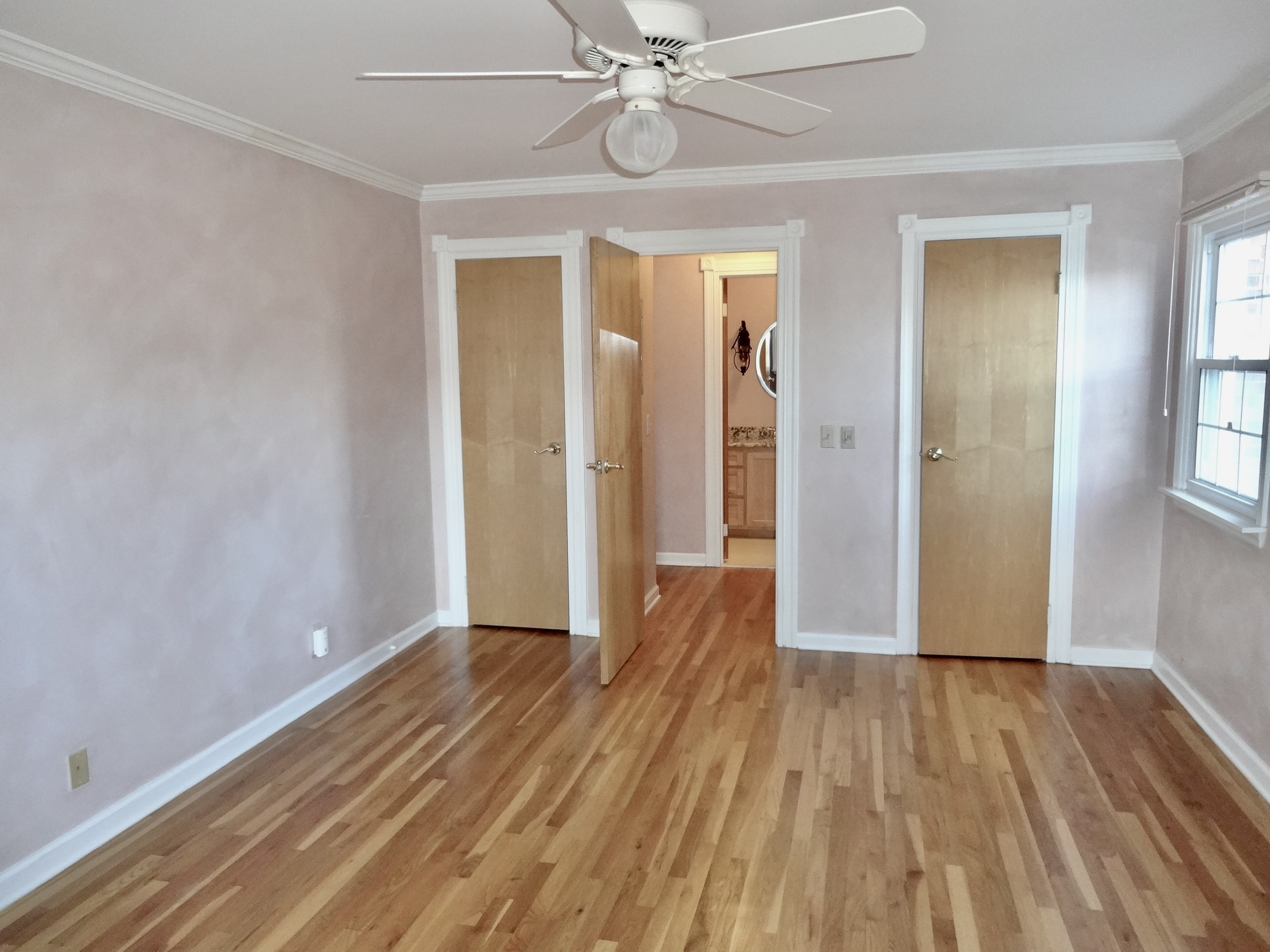 245 Unquowa Road, Unit 34 Fairfield, CT 06824 - Photo 21 of 24 a view of a room with wooden floor and door