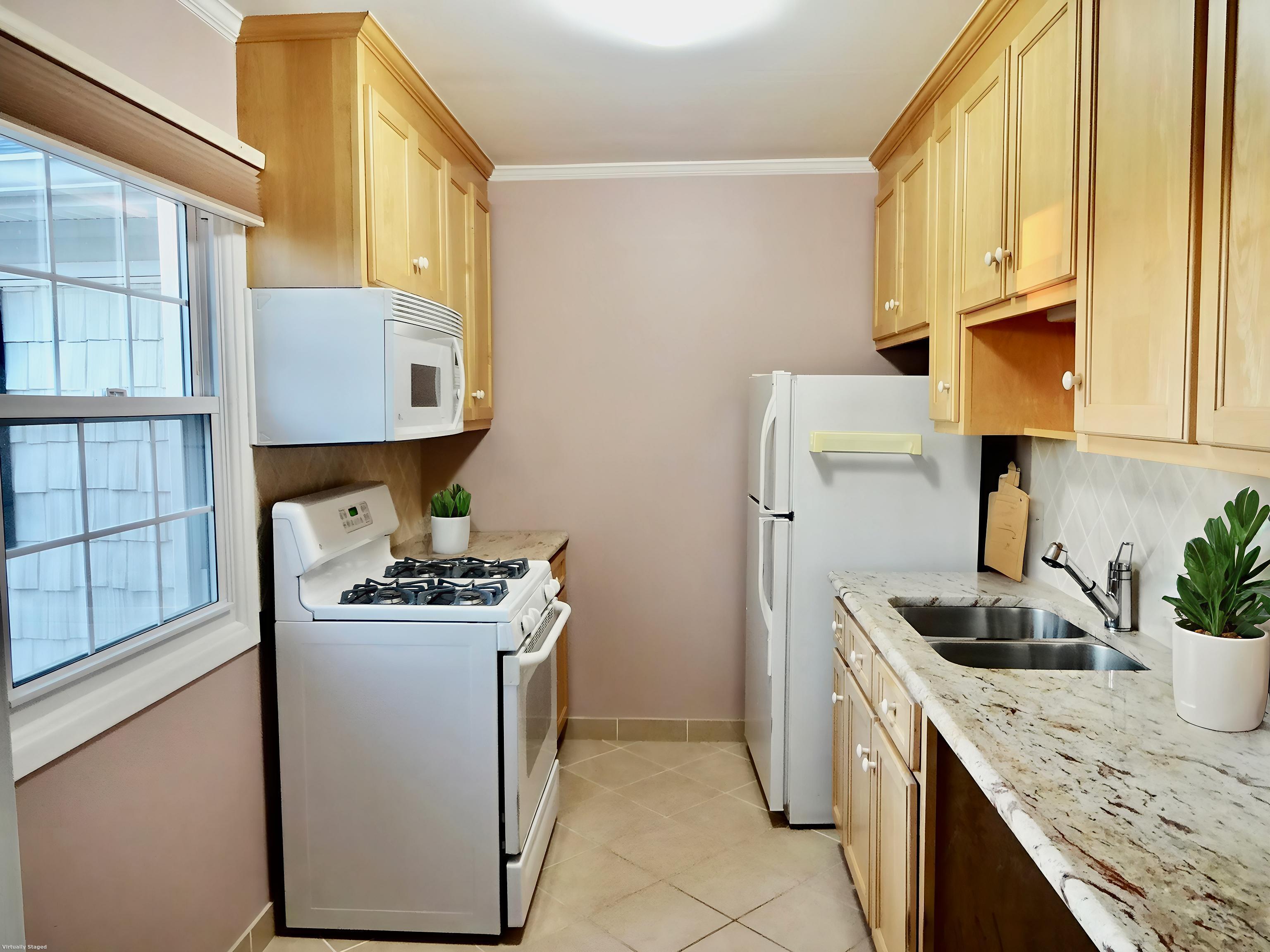 245 Unquowa Road, Unit 34 Fairfield, CT 06824 - Photo 6 of 24 a kitchen with stainless steel appliances granite countertop a sink stove and refrigerator
