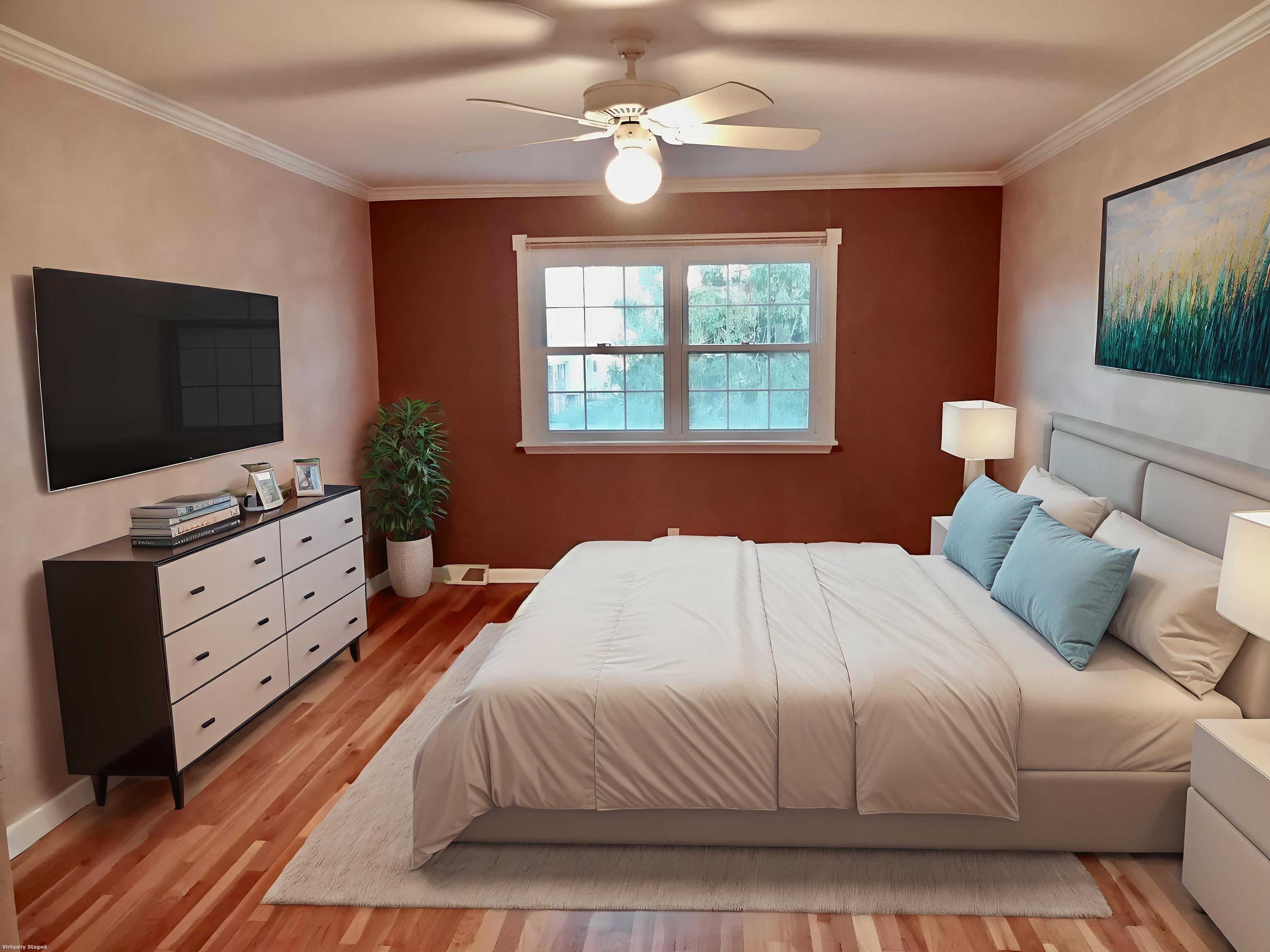 245 Unquowa Road, Unit 34 Fairfield, CT 06824 - Photo 10 of 24 a bedroom with a bed and a flat screen tv