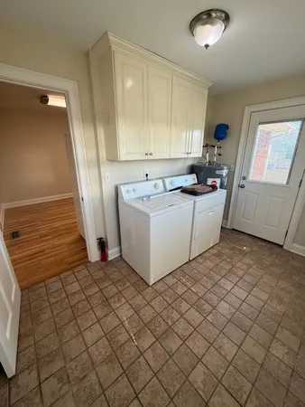 a kitchen with a sink and a refrigerator