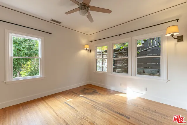a view of a room with wooden floor