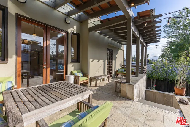 front view of a house with outdoor seating