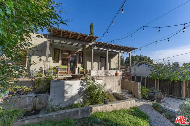 a view of a chairs and table in patio
