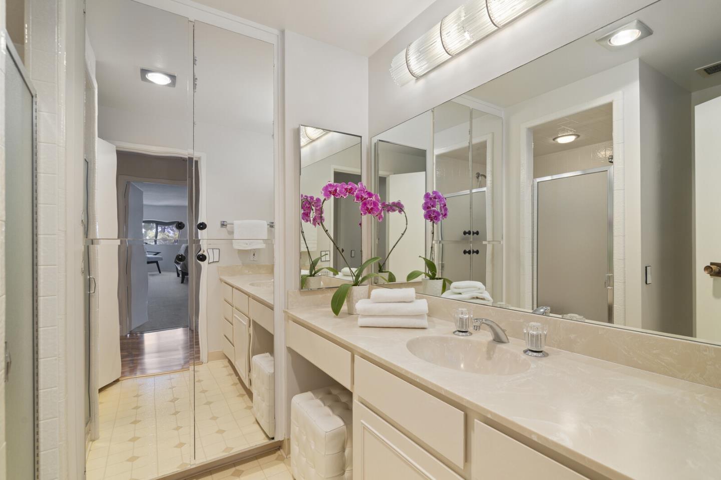 50 Mounds Road, Unit 415 San Mateo, CA 94402 - Photo 18 of 29 a bathroom with a sink vanity mirror and shower