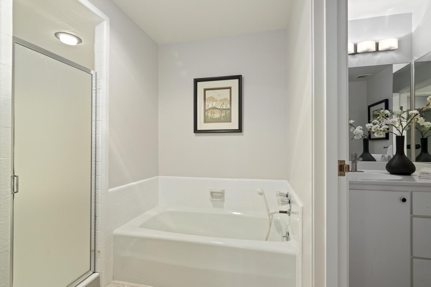 50 Mounds Road, Unit 415 San Mateo, CA 94402 - Photo 22 of 29 a white bath tub sitting next to a white sink