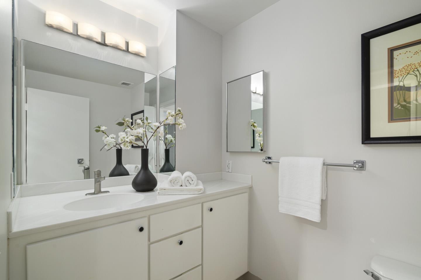 50 Mounds Road, Unit 415 San Mateo, CA 94402 - Photo 23 of 29 a bathroom with a sink vanity and a mirror