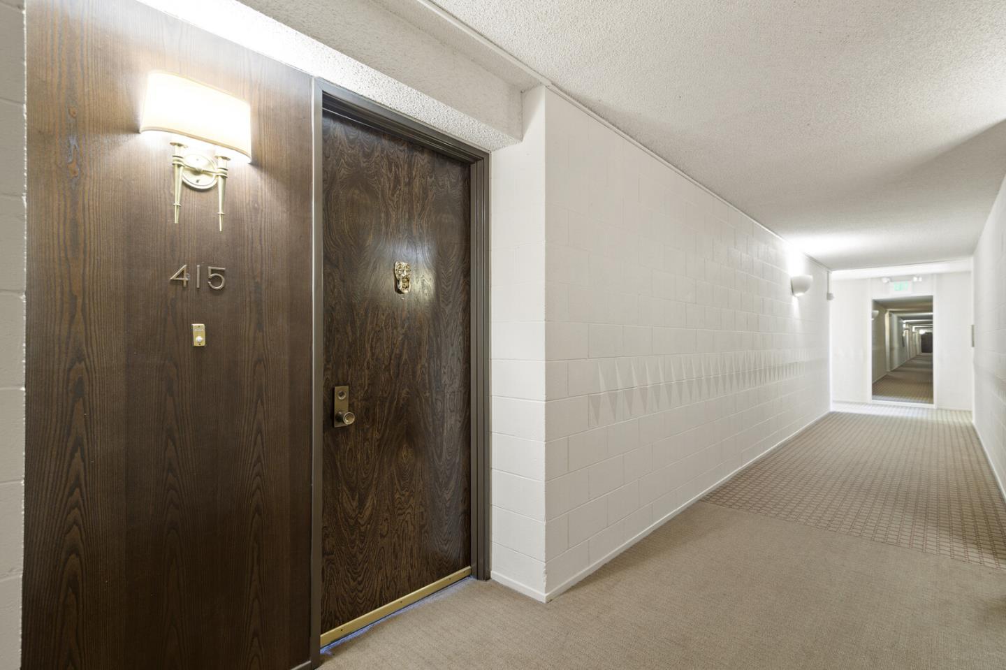 50 Mounds Road, Unit 415 San Mateo, CA 94402 - Photo 4 of 29 a view of a hallway with a elevator
