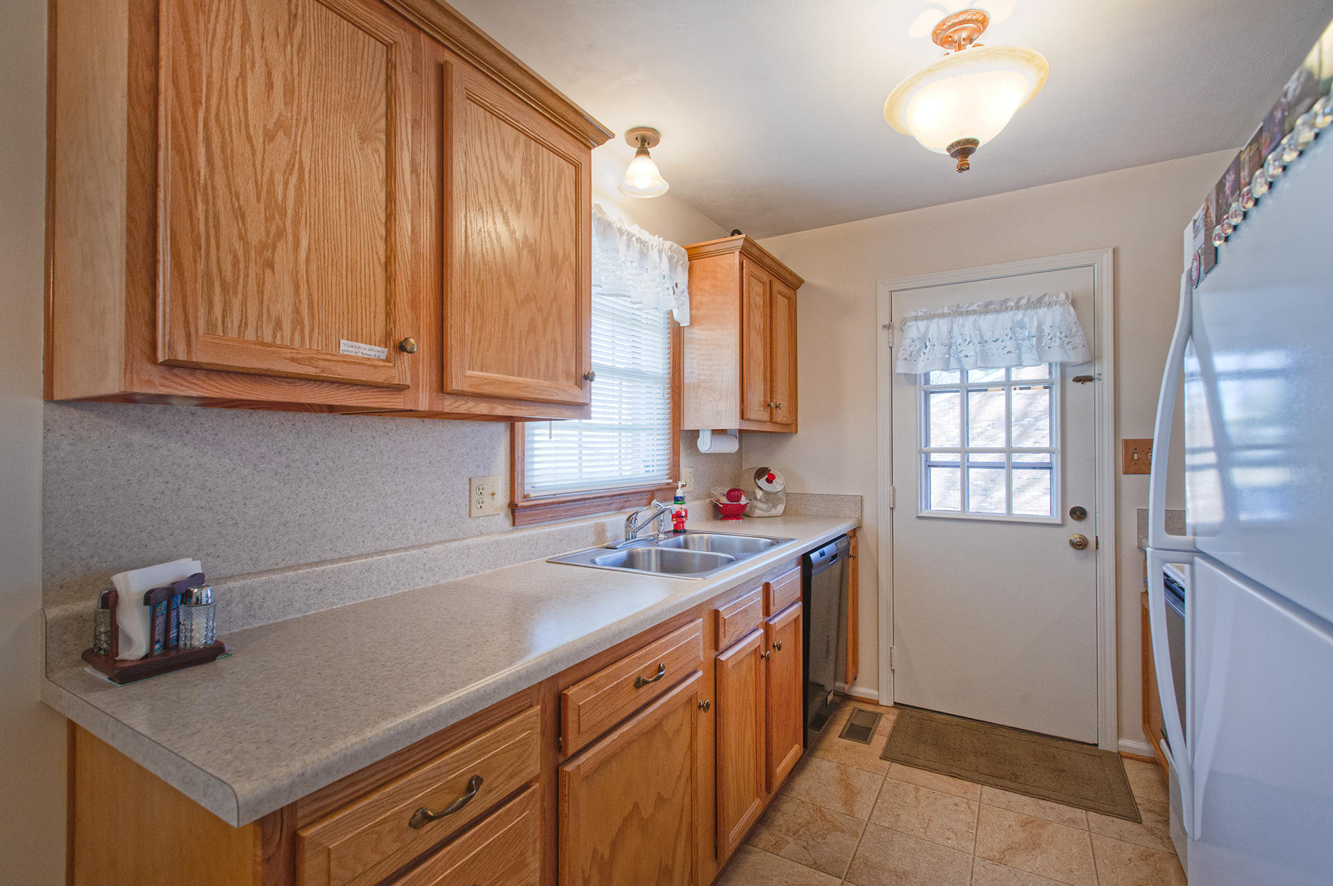 2015 Kiska Road Salem, VA 24153 - Photo 8 of 25 a kitchen with stainless steel appliances granite countertop a sink stove and cabinets