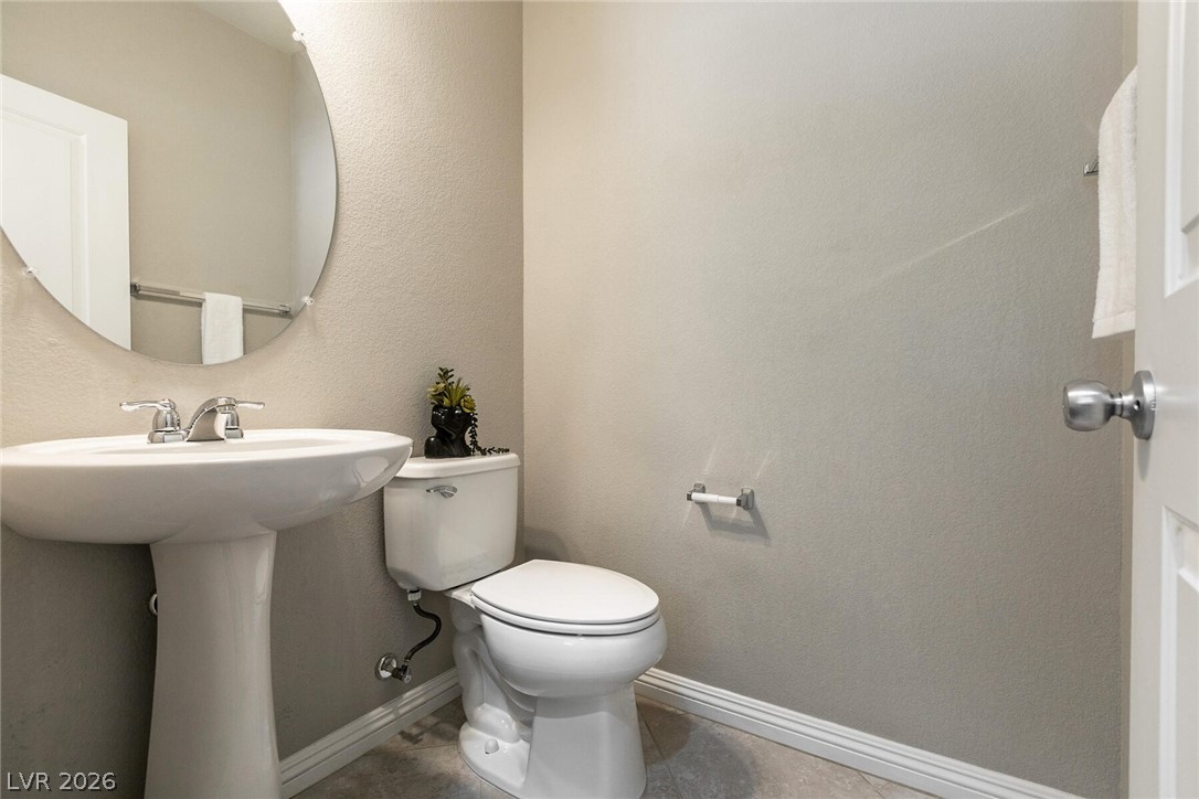 3045 Camino Rico Avenue Henderson, NV 89044 - Photo 17 of 44 Half bathroom featuring a textured wall