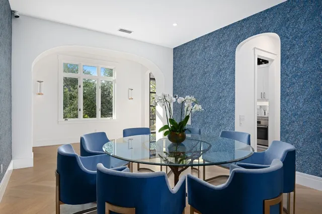 a living room with furniture large window and a flat screen tv