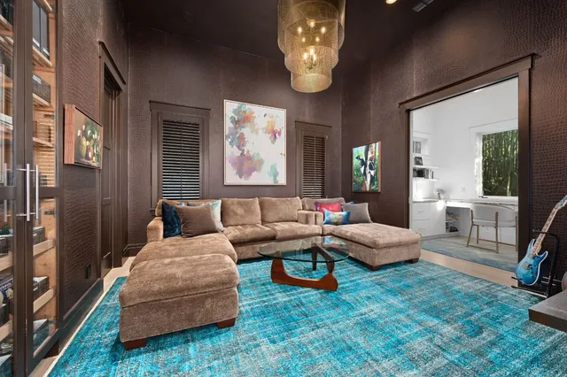 a large white kitchen with stainless steel appliances