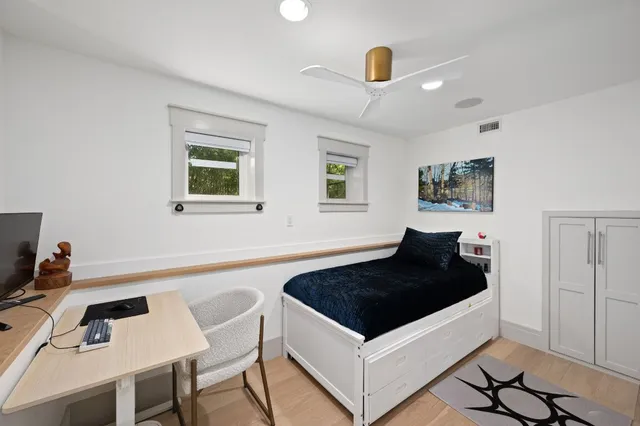 a bathroom with a toilet a sink and a mirror