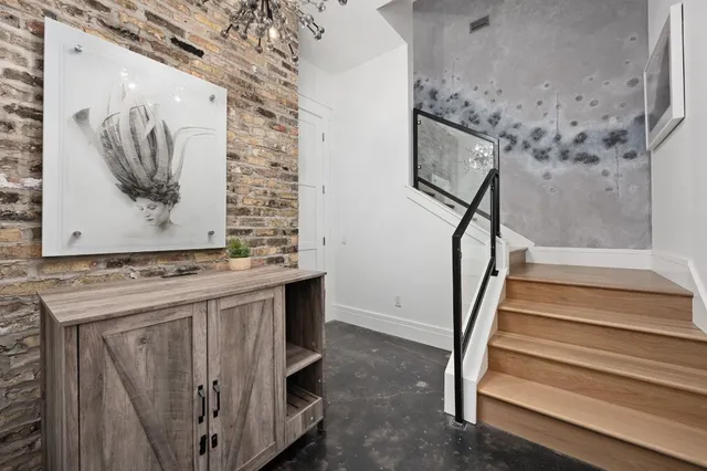 a kitchen with a sink a stove and white cabinets
