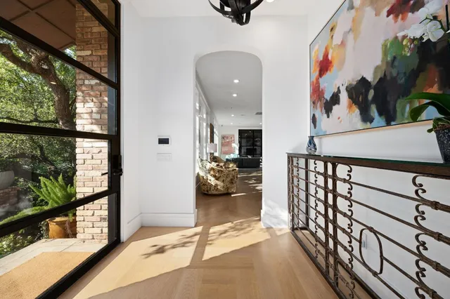a kitchen with stainless steel appliances granite countertop a sink a stove and a wooden cabinets