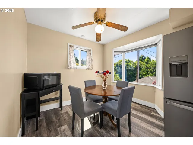 a bathroom with a toilet sink vanity and mirror