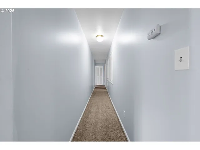 a bedroom with a bed and a ceiling fan