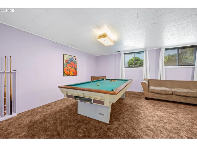 a living room with a flat screen tv and a fireplace