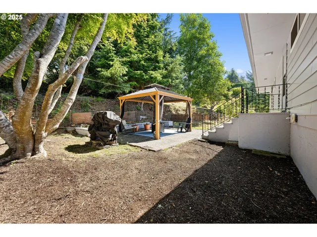 a house view with a backyard space
