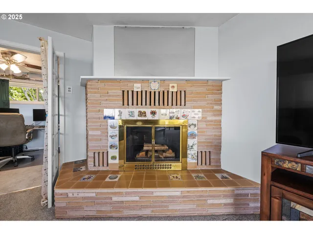 a view of a workspace with furniture and a chandelier