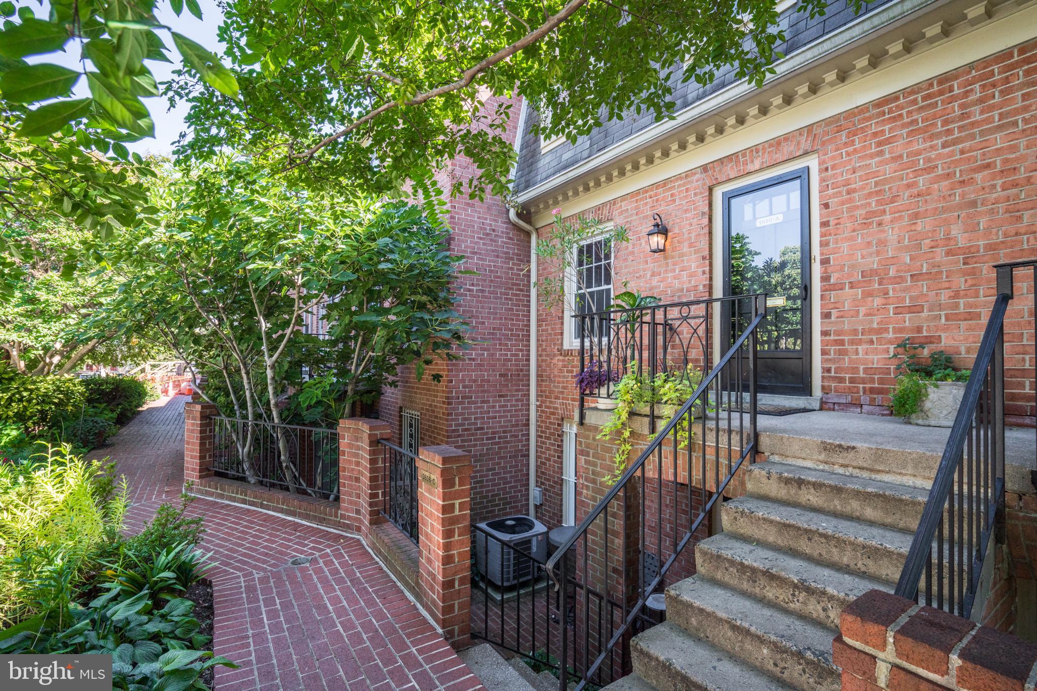 1616 Belmont Street Northwest, Unit A Washington, DC 20009 - Photo 2 of 25 a view of a house with backyard and sitting area