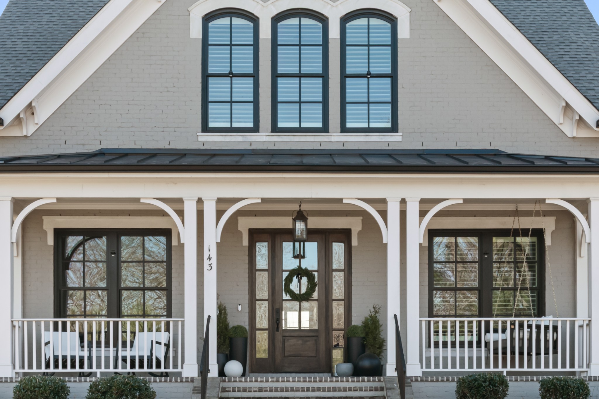 143 Splendor Ridge Drive Franklin, TN 37064 - Photo 5 of 75 a view of a brick house with large windows