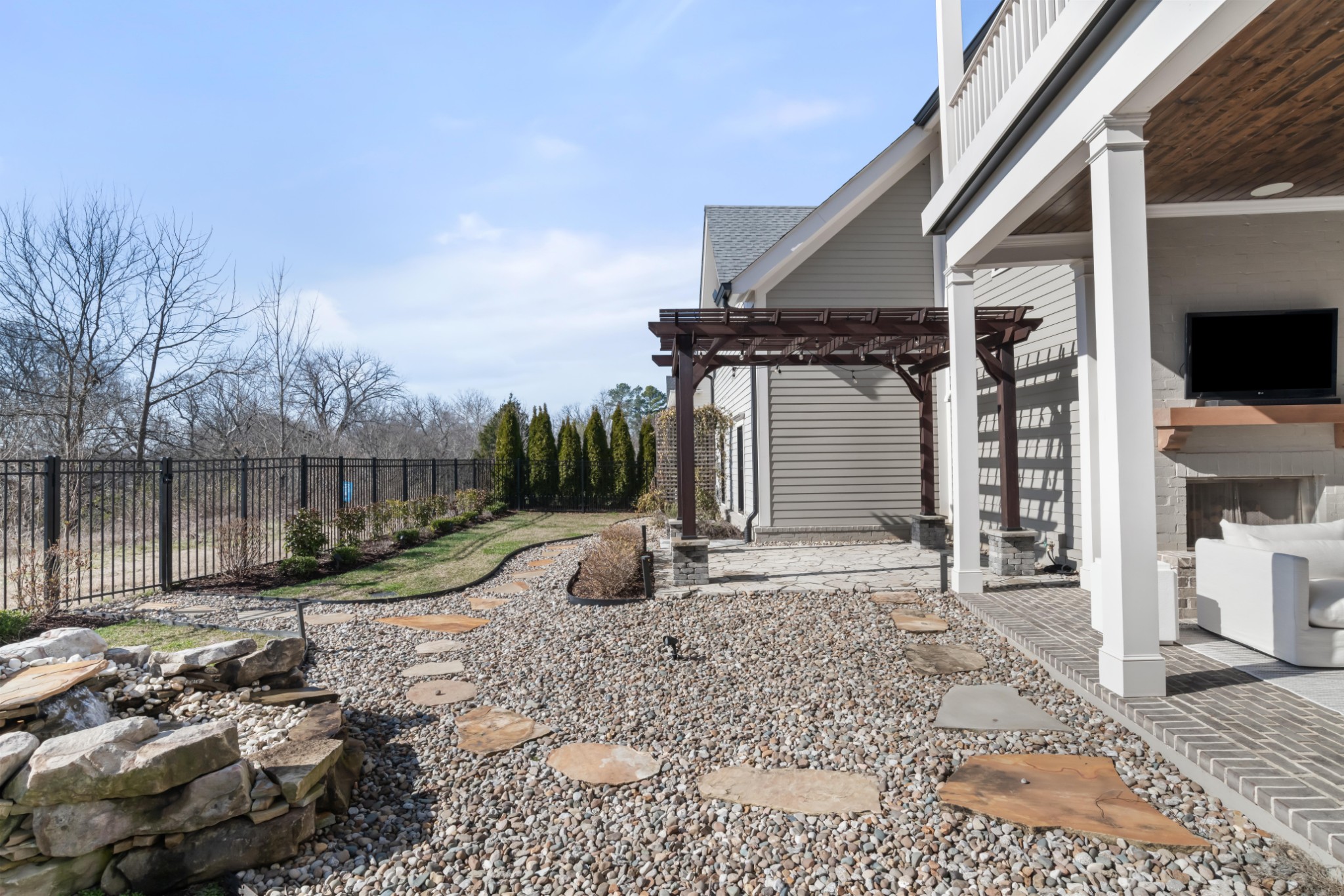 143 Splendor Ridge Drive Franklin, TN 37064 - Photo 68 of 75 a backyard of a house with barbeque oven table and chairs