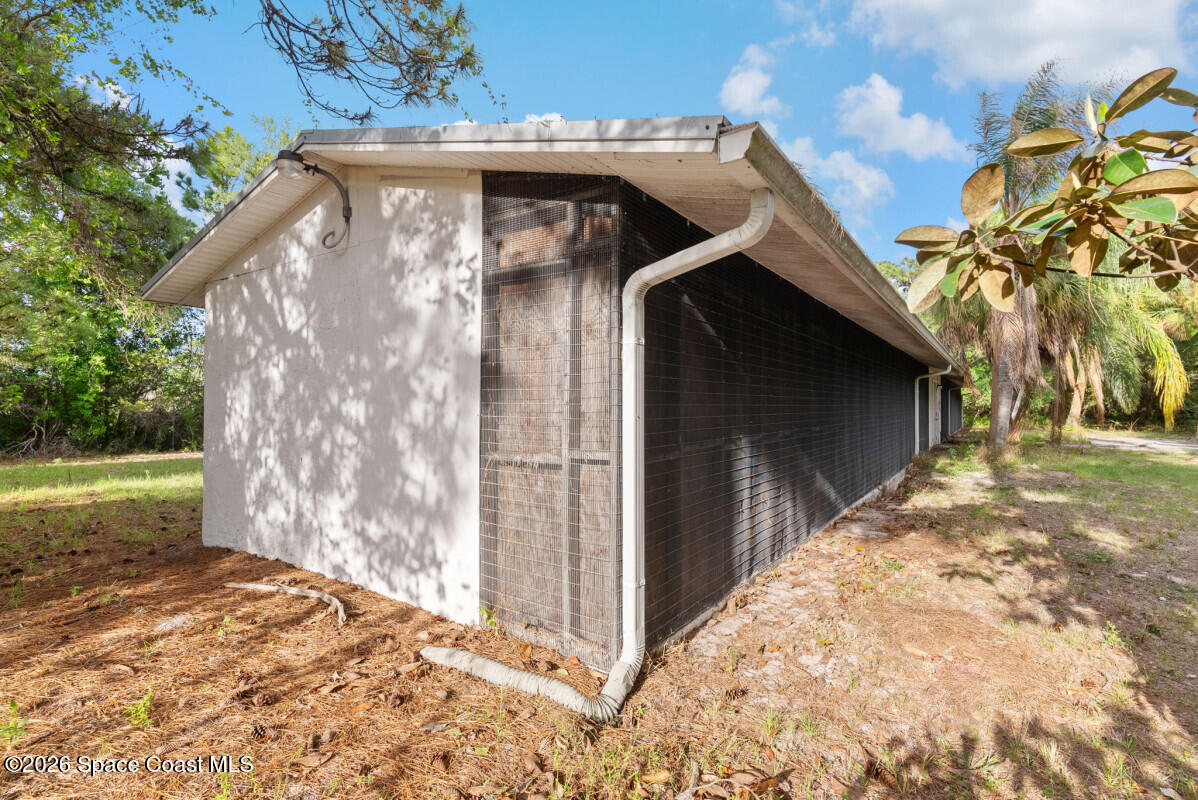 2493 Adamson Road Cocoa, FL 32926 - Photo 15 of 46 a view of backyard with barbeque grill and wooden fence
