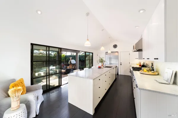 a large living room with furniture and a large window