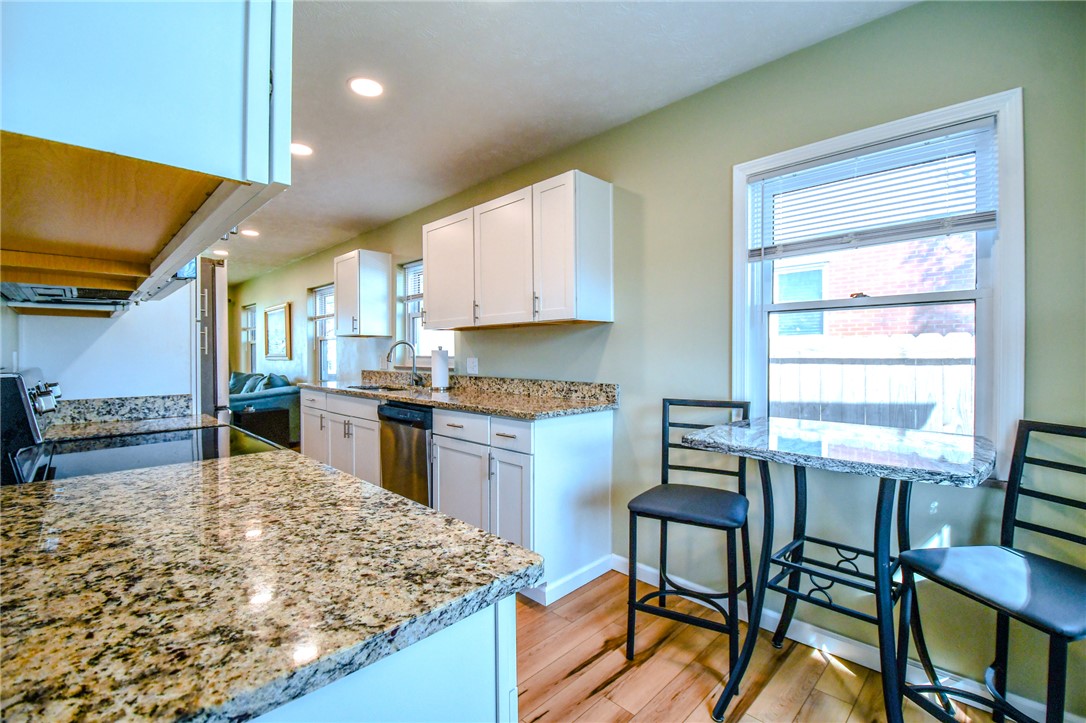 816 South Smithville Road Dayton, OH 45403 - Photo 14 of 33 This bright kitchen features gleaming granite counters and abundant cabinet space.