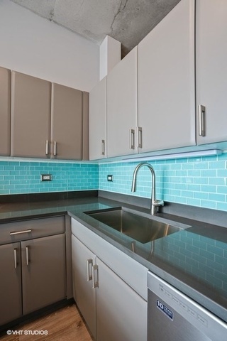 235 West Van Buren Street, Unit 1505 Chicago, IL 60607 - Photo 13 of 28 a kitchen with a sink cabinets and washing machine