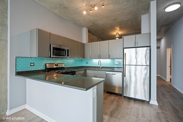 235 West Van Buren Street, Unit 1505 Chicago, IL 60607 - Photo 14 of 28 a kitchen with refrigerator and microwave