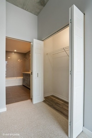 235 West Van Buren Street, Unit 1505 Chicago, IL 60607 - Photo 17 of 28 a bathroom with a sink and a shower