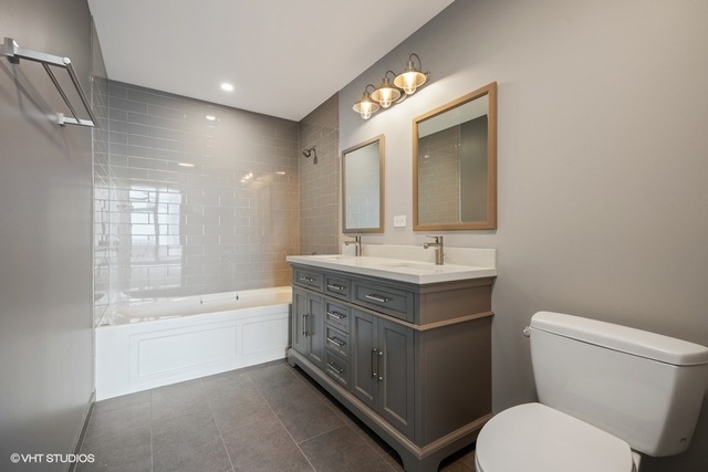 235 West Van Buren Street, Unit 1505 Chicago, IL 60607 - Photo 18 of 28 a bathroom with a sink a toilet and bathtub