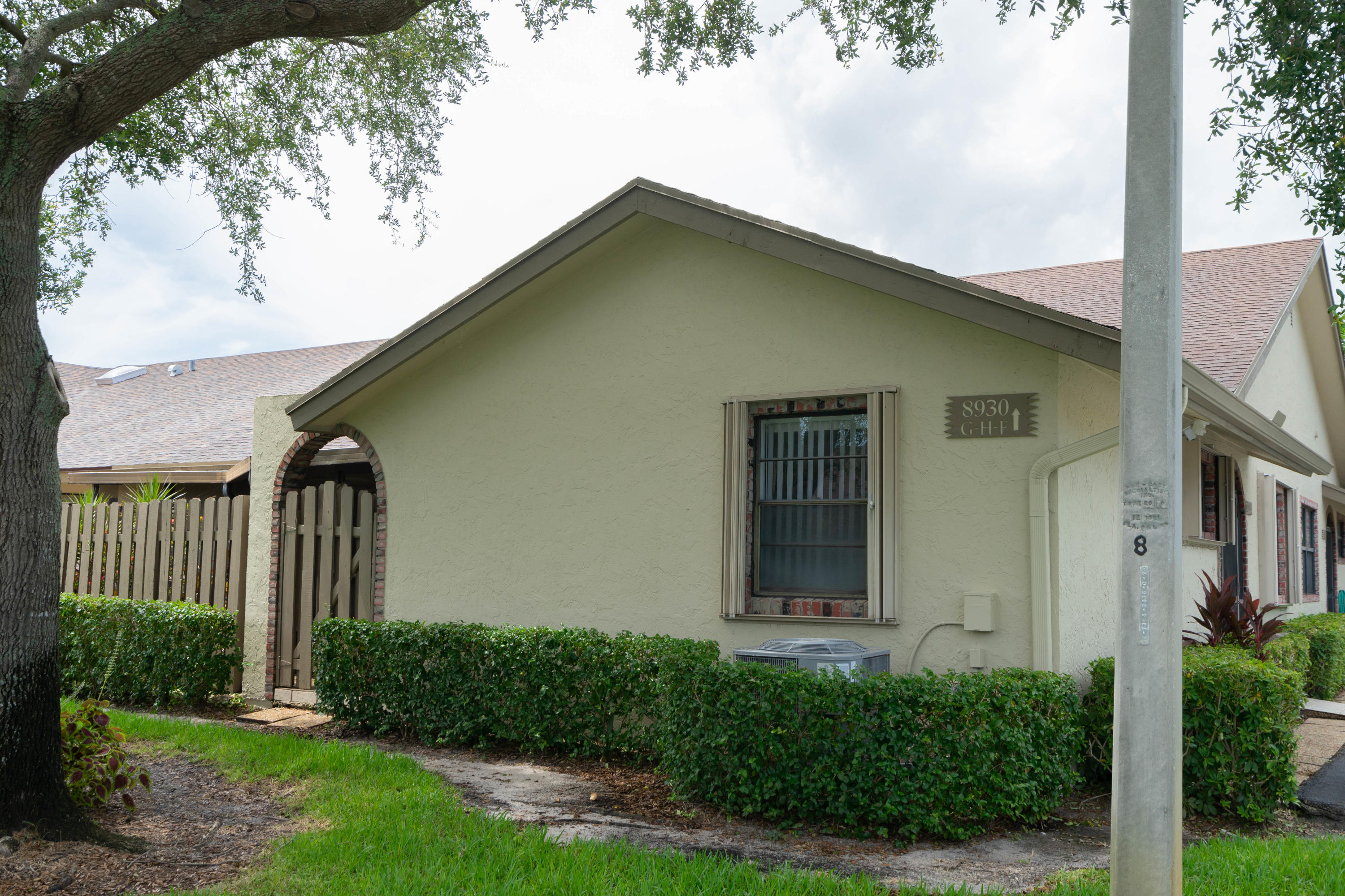 8930 Southwest 19th Street, Unit G Boca Raton, FL 33433 - Photo 18 of 18 a front view of a house with garden