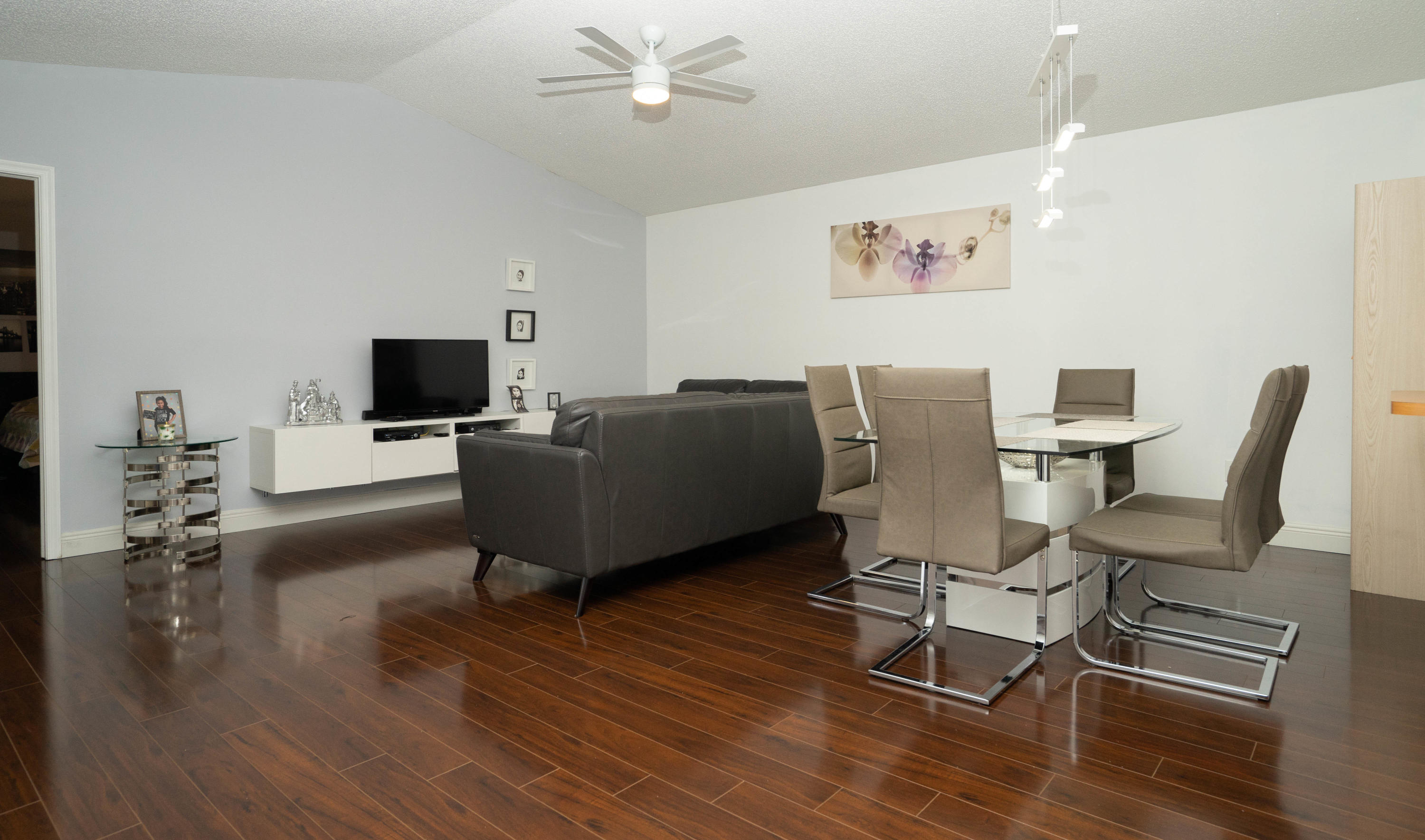 8930 Southwest 19th Street, Unit G Boca Raton, FL 33433 - Photo 3 of 18 a living room with furniture and a flat screen tv