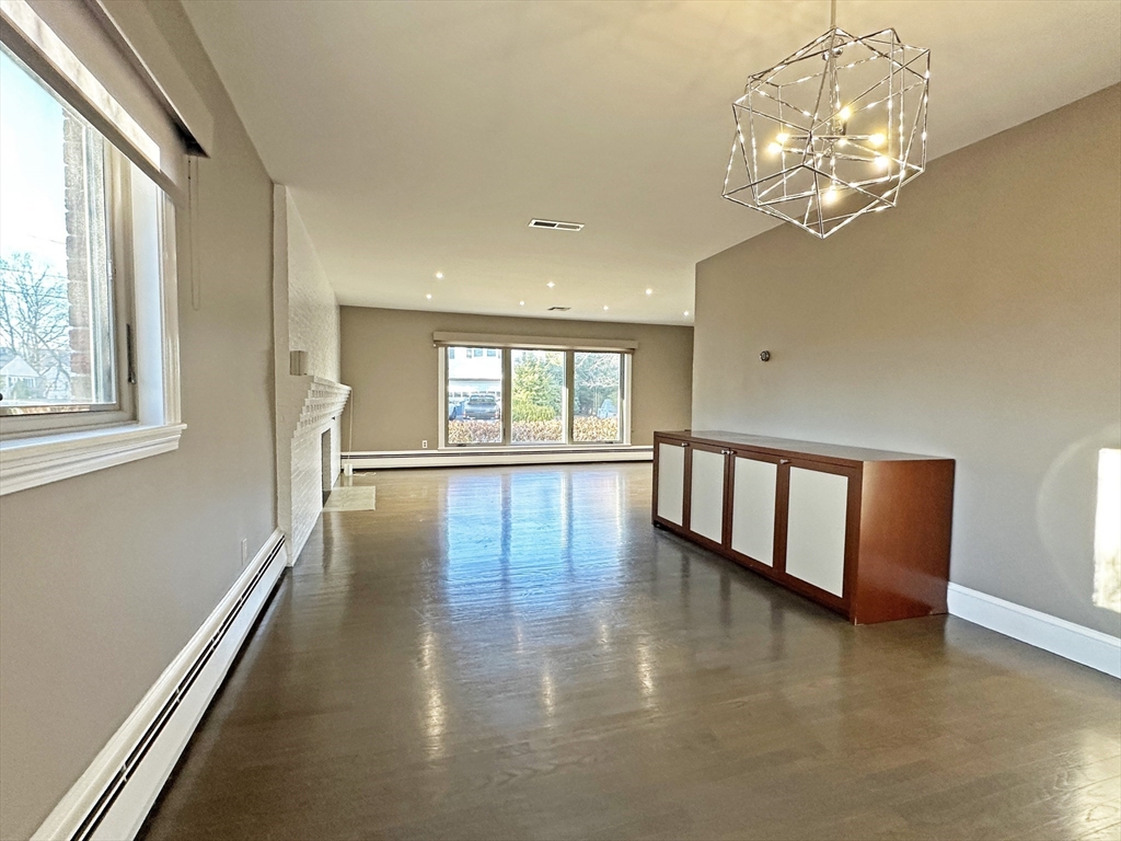 6 Brownson Terrace Boston, MA 02130 - Photo 11 of 38 a view of an empty room with wooden floor and a window